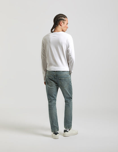 Jeans regular fit con strappi